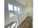 Bright hallway landing with a view from the window and stylish flooring at 522 Healy Dr # 66, Cumming, GA 30040