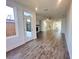 Open-concept living space with seamless flow to kitchen and outdoor area, modern finishes, and hardwood floors at 522 Healy Dr # 66, Cumming, GA 30040