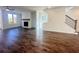 Spacious living room with hardwood floors, fireplace, and abundant natural light from large windows at 522 Healy Dr # 66, Cumming, GA 30040
