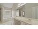 Bathroom features a double sink vanity, large mirror, and a window at 5706 Spring Mill Cir, Lithonia, GA 30038