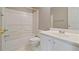 Bright bathroom features a shower-tub combo and modern vanity at 5706 Spring Mill Cir, Lithonia, GA 30038