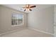 Cozy bedroom with a ceiling fan and a window that lets in plenty of natural light at 5706 Spring Mill Cir, Lithonia, GA 30038