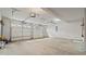 Spacious two-car garage with two automatic doors, and painted walls at 5706 Spring Mill Cir, Lithonia, GA 30038