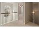 Well-lit hallway features carpeted floors and leads to multiple rooms upstairs at 5706 Spring Mill Cir, Lithonia, GA 30038