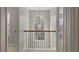 Upstairs hallway featuring an arched window and carpet flooring that provides comfort and style at 5706 Spring Mill Cir, Lithonia, GA 30038