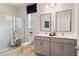 Bright bathroom featuring double vanity, large shower, and modern fixtures at 1465 Auburn Glen Rd, Dacula, GA 30019