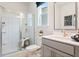 Bright bathroom featuring a shower and sleek countertops at 1465 Auburn Glen Rd, Dacula, GA 30019