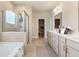 Elegant bathroom with double vanity, glass-enclosed shower, and modern fixtures at 1465 Auburn Glen Rd, Dacula, GA 30019