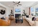 Living room with a fireplace, TV, and comfortable seating at 1465 Auburn Glen Rd, Dacula, GA 30019