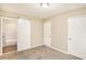 Spacious bedroom featuring a modern sliding door leading to an attached bathroom at 1643 Pine Glen Cir, Decatur, GA 30035