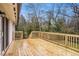 A newly constructed wooden deck with a railing, offering outdoor space at 1643 Pine Glen Cir, Decatur, GA 30035