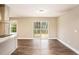 Open dining area with hardwood flooring and access to an outdoor deck at 1643 Pine Glen Cir, Decatur, GA 30035