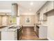 A kitchen with granite countertops, stainless steel appliances, and an island cooktop/oven at 1643 Pine Glen Cir, Decatur, GA 30035