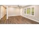 Bright living room featuring hardwood floors, neutral walls, and natural light from large windows at 1643 Pine Glen Cir, Decatur, GA 30035