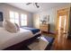 Well-lit bedroom with hardwood floors and a plush area rug featuring a comfortable bed at 2791 Pearl St, East Point, GA 30344