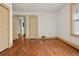 Bedroom featuring hardwood floors, natural light, a window, and neutral wall paint at 2791 Pearl St, East Point, GA 30344