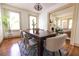 Bright dining room features hardwood floors, neutral walls and adjacent living space, perfect for entertaining at 2791 Pearl St, East Point, GA 30344