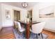 Dining room with modern light fixture, a rustic table, and contemporary artwork at 2791 Pearl St, East Point, GA 30344