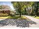 Charming home with mature trees and a driveway nestled in a leafy neighborhood at 2791 Pearl St, East Point, GA 30344