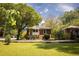 Quaint brick home showcasing a well-manicured lawn and established greenery at 2791 Pearl St, East Point, GA 30344