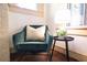 Cozy sitting area with arm chair by window and table lamp at 2791 Pearl St, East Point, GA 30344