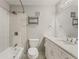 A clean bathroom with a shower-tub combo, toilet, and vanity with a mirror at 6700 Roswell Rd # 15B, Atlanta, GA 30328