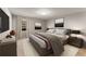 Stylishly staged bedroom with large bed, modern furniture, and ample natural light at 6700 Roswell Rd # 15B, Atlanta, GA 30328