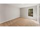 Cozy bedroom featuring neutral walls, plush carpet, and a window offering natural light at 6700 Roswell Rd # 15B, Atlanta, GA 30328
