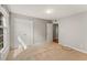 A carpeted bedroom with a window, walk-in closet, and adjacent room access at 6700 Roswell Rd # 15B, Atlanta, GA 30328