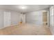 Spacious bedroom with neutral walls, carpet flooring, and easy access to the ensuite bathroom at 6700 Roswell Rd # 15B, Atlanta, GA 30328