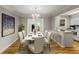 Bright dining room featuring a chandelier, an elegant marble table, and access to the outdoors at 6700 Roswell Rd # 15B, Atlanta, GA 30328
