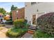 Charming townhome entrance with mature landscaping and a welcoming entryway and a 'Welcome' mat at 6700 Roswell Rd # 15B, Atlanta, GA 30328