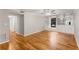 Living room featuring hardwood flooring, custom built-ins, and a large window at 6700 Roswell Rd # 15B, Atlanta, GA 30328