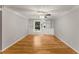 Bright living room featuring hardwood flooring, custom built-ins, and neutral paint at 6700 Roswell Rd # 15B, Atlanta, GA 30328