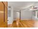 Inviting living room with hardwood floors, a ceiling fan, and built-in shelving, creating a cozy ambiance at 6700 Roswell Rd # 15B, Atlanta, GA 30328