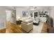 Staged living room with hardwood floors, built-in shelving, and stylish furniture at 6700 Roswell Rd # 15B, Atlanta, GA 30328