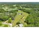 Expansive property with golf course view surrounded by lush greenery and ponds at 714 Billings Farm Ln, Canton, GA 30115