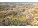 Panoramic aerial view of the property surrounded by ponds, trees, and greenery at 714 Billings Farm Ln, Canton, GA 30115