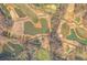 Aerial view of a property with a golf course and a pond at 714 Billings Farm Ln, Canton, GA 30115
