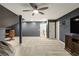 Finished basement with carpet, ceiling fan, television, and playful decor at 714 Billings Farm Ln, Canton, GA 30115