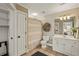 Full bathroom offering a shower, vanity, and toilet with an adjacent closet and storage space at 714 Billings Farm Ln, Canton, GA 30115