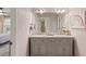 Bathroom with double sink, marble countertops, and charming decor at 714 Billings Farm Ln, Canton, GA 30115
