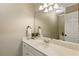 Half bathroom featuring a modern sink and a vanity with a large mirror and modern lighting at 714 Billings Farm Ln, Canton, GA 30115