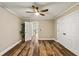 Comfortable bedroom with wood-look flooring and a ceiling fan at 714 Billings Farm Ln, Canton, GA 30115