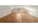 Large bonus room featuring hardwood floors and a bright sunny window at 714 Billings Farm Ln, Canton, GA 30115
