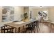 Modern dining room with large windows and a table for six, perfect for gatherings at 714 Billings Farm Ln, Canton, GA 30115