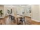 Bright dining room with views of backyard through large windows, adjacent to living area at 714 Billings Farm Ln, Canton, GA 30115