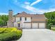 Charming home with 3-car garage, lush landscaping and a brick chimney at 714 Billings Farm Ln, Canton, GA 30115