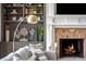 Close-up of the fireplace with white mantel and built-in shelves at 714 Billings Farm Ln, Canton, GA 30115