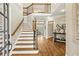 Grand two-story foyer with hardwood floors and elegant staircase, showcasing a bright and inviting entrance at 714 Billings Farm Ln, Canton, GA 30115